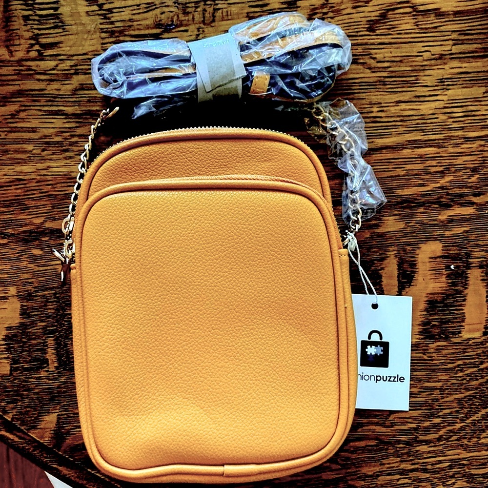 NWT cross body purse. Leather-like. Deep mustard color. Fun summer bag!